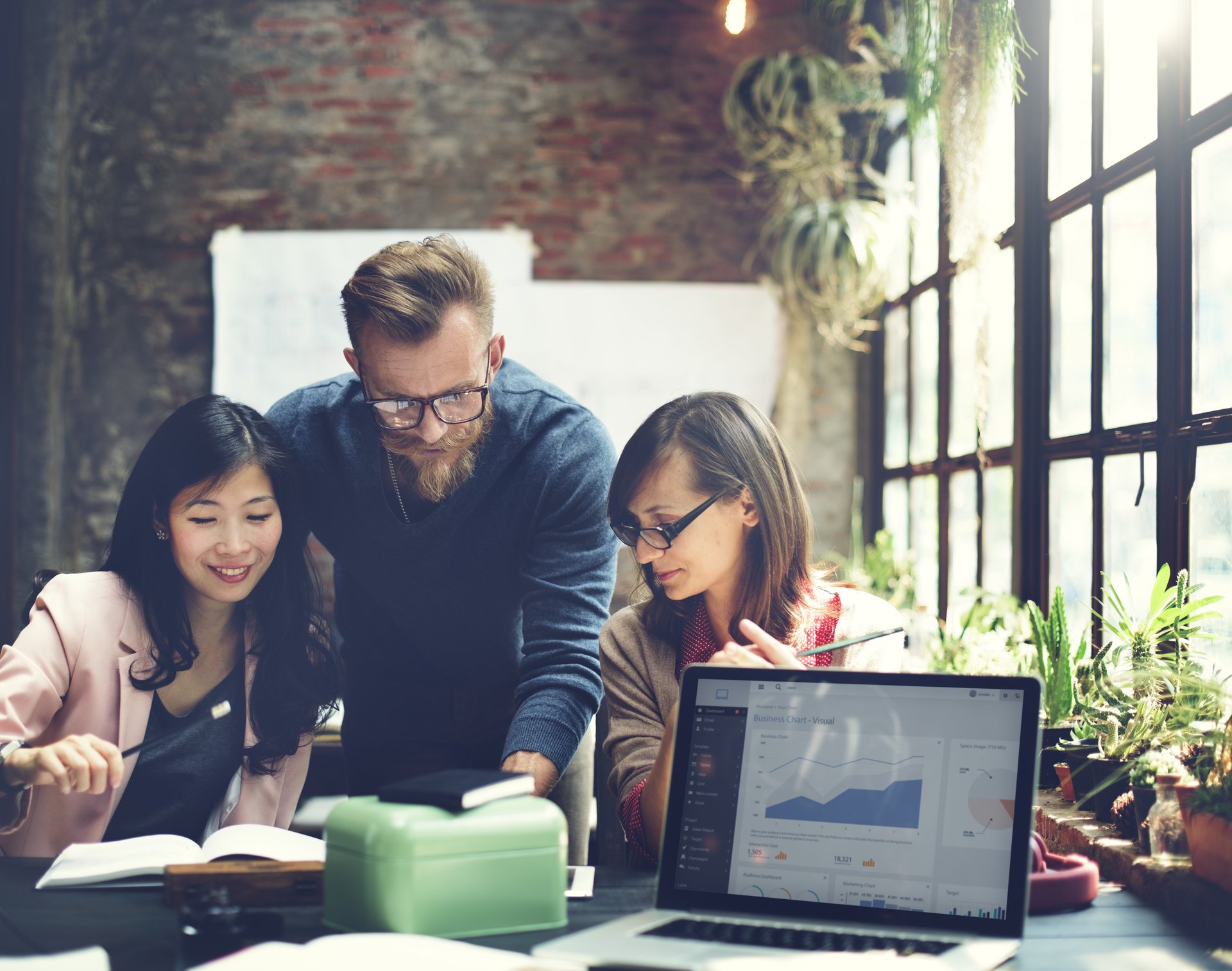 A team works on reviewing data