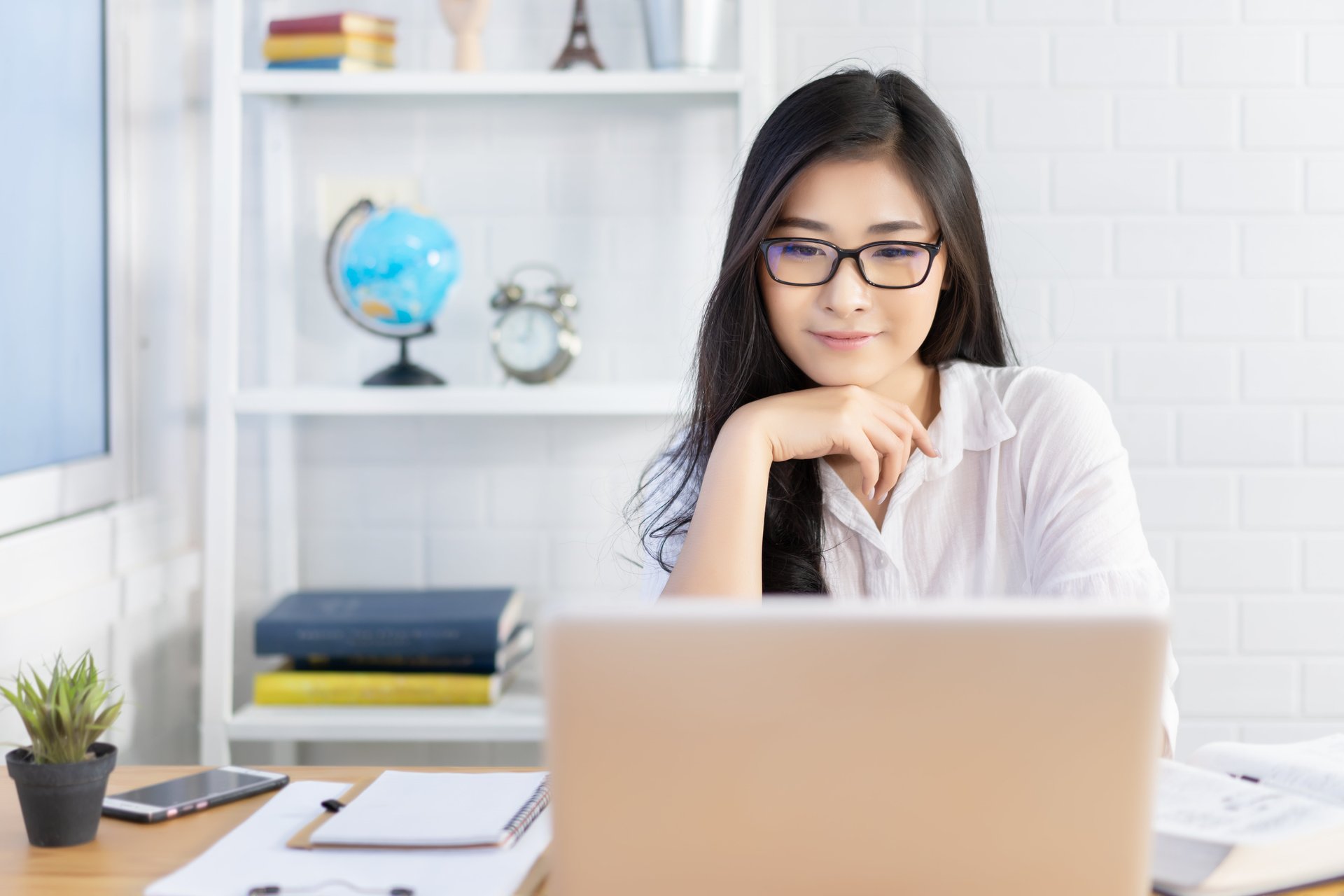 Young woman learning on her laptop