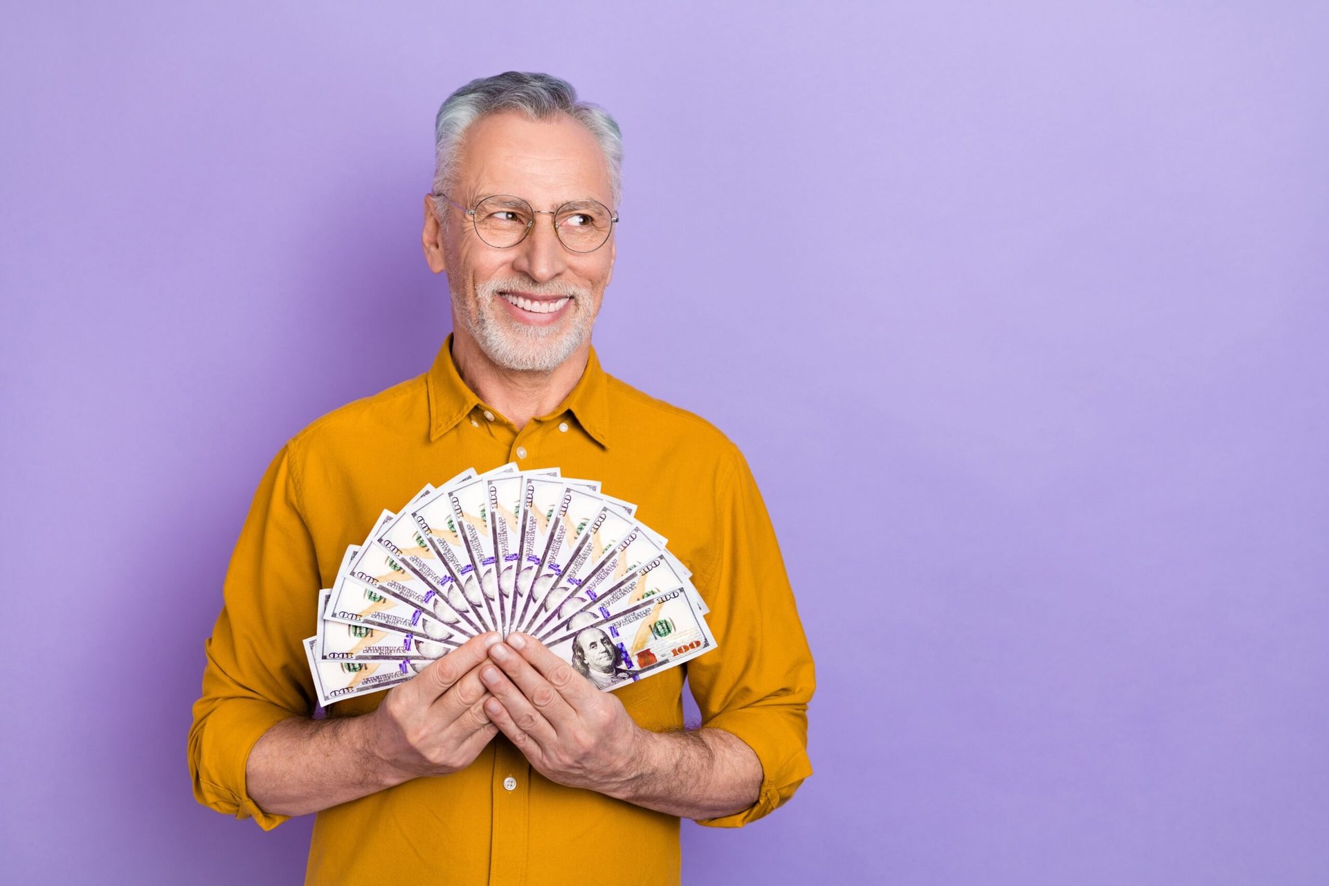 senior man with lots of cash