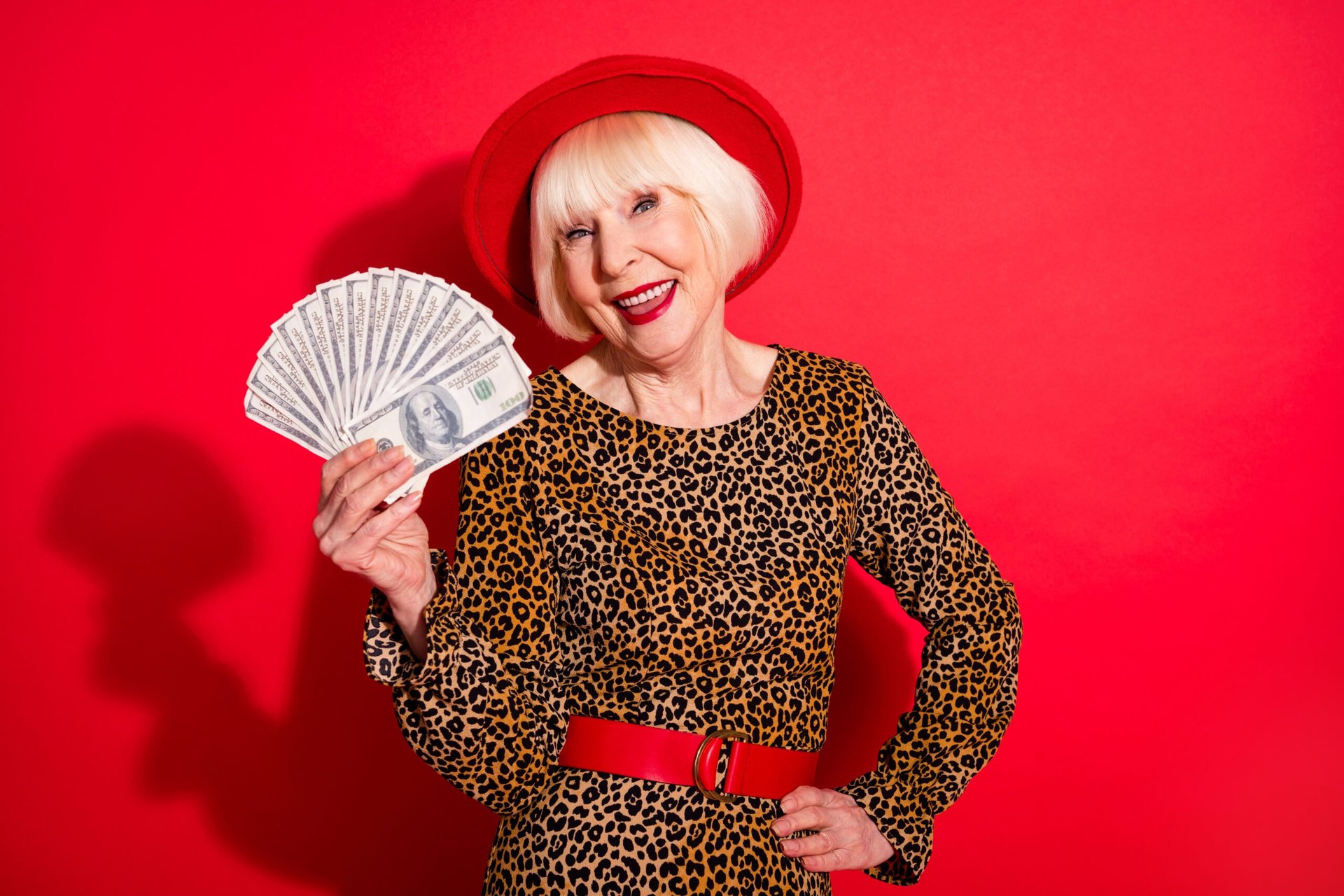 Older woman with handful of cash