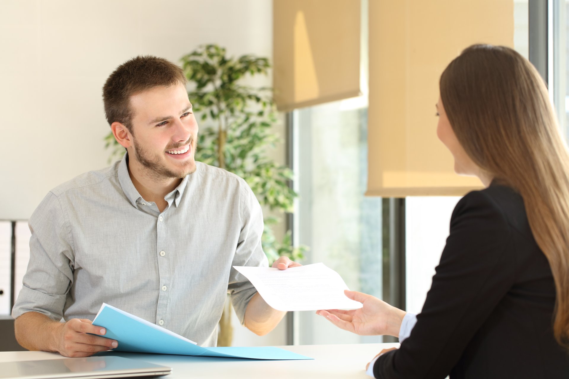 Handing resume to interviewer